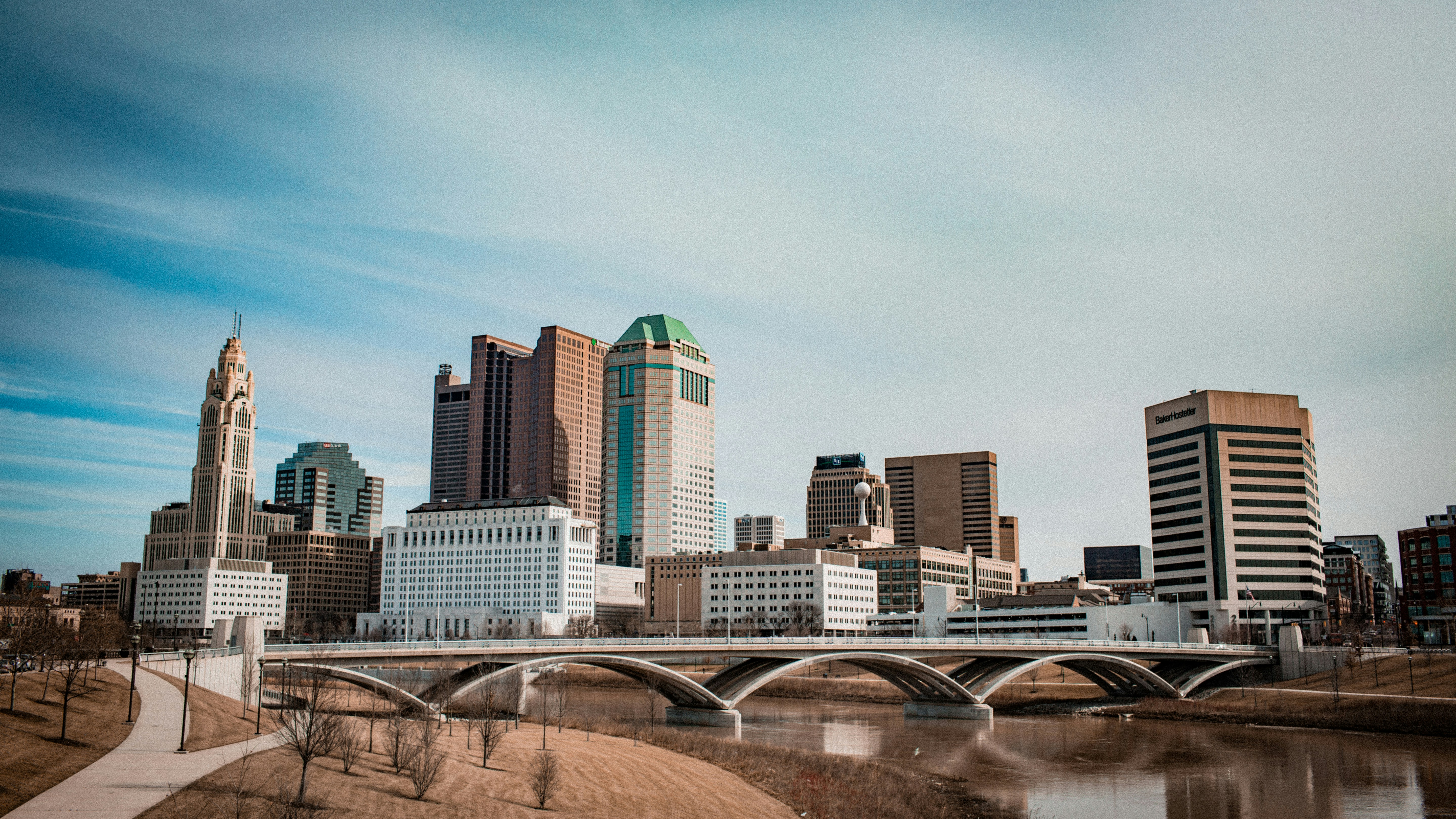 ALT= Debt Collection Agency in Akron Ohio + picture downtown Akron OH + longshot + bridge + cloudy sky