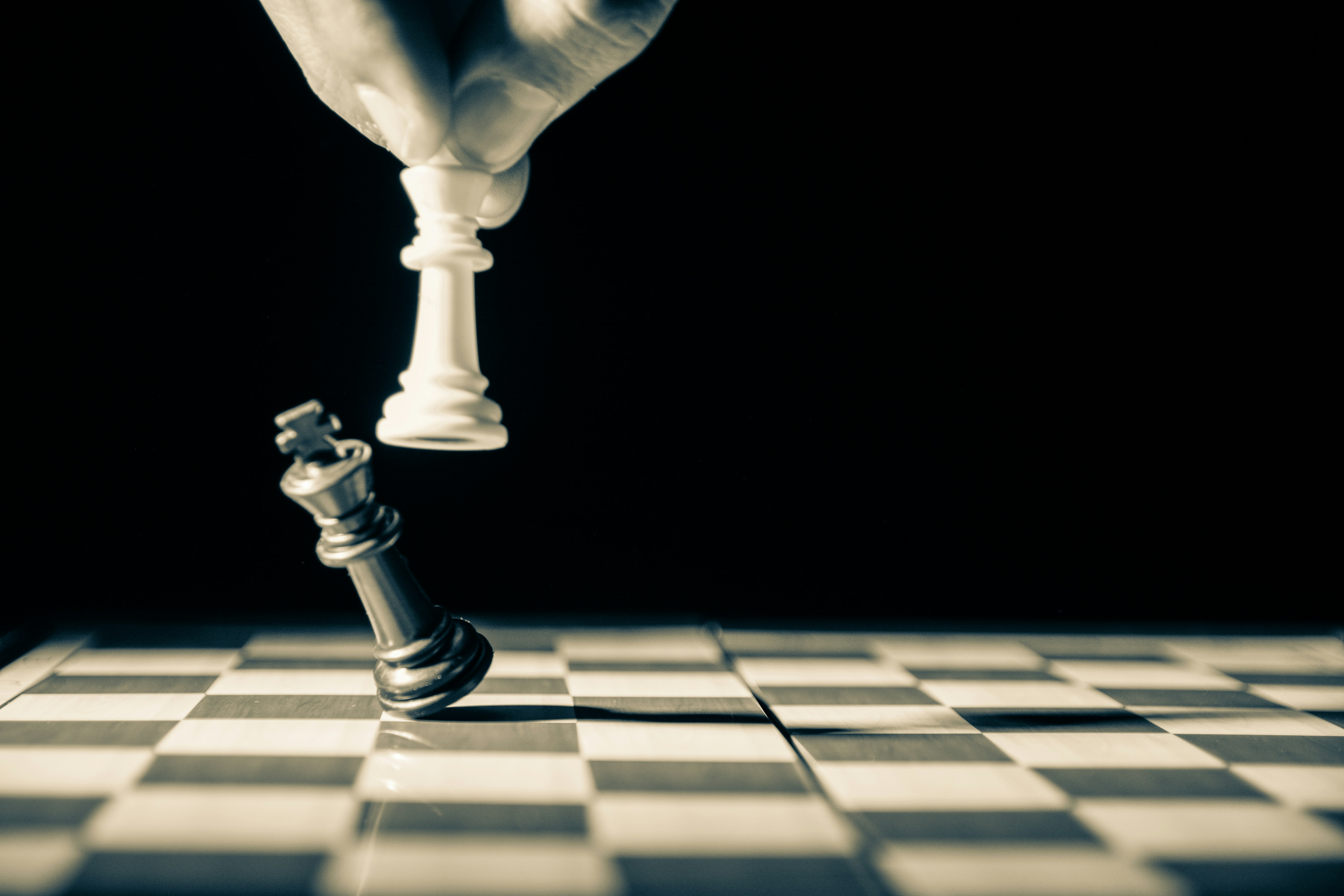 ALT = Commercial Debt Collection Agency + picture + black and white + hand playing chess + chess board