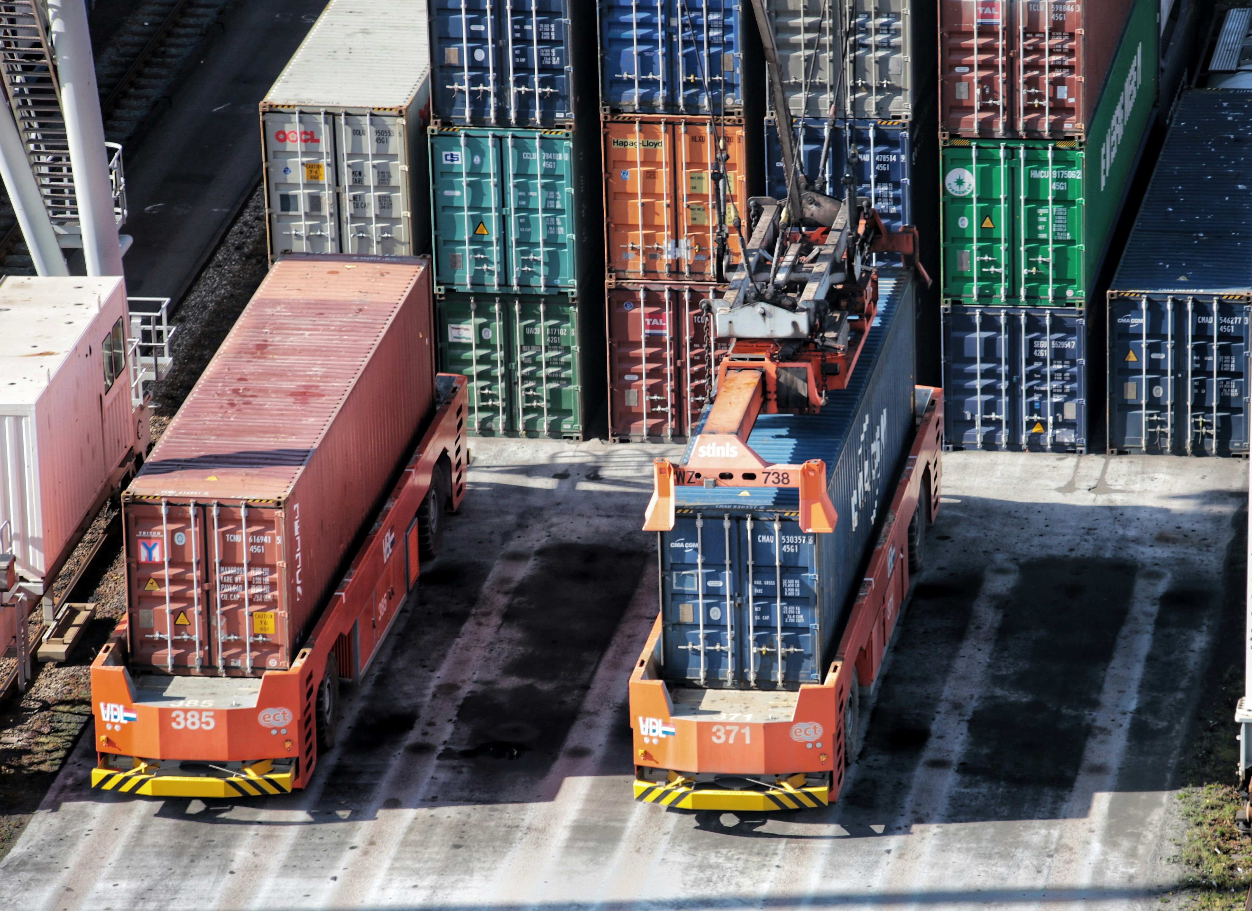 several shipping containers in a shipping yard to represent transportation, logistics, freight forwarding debt collections