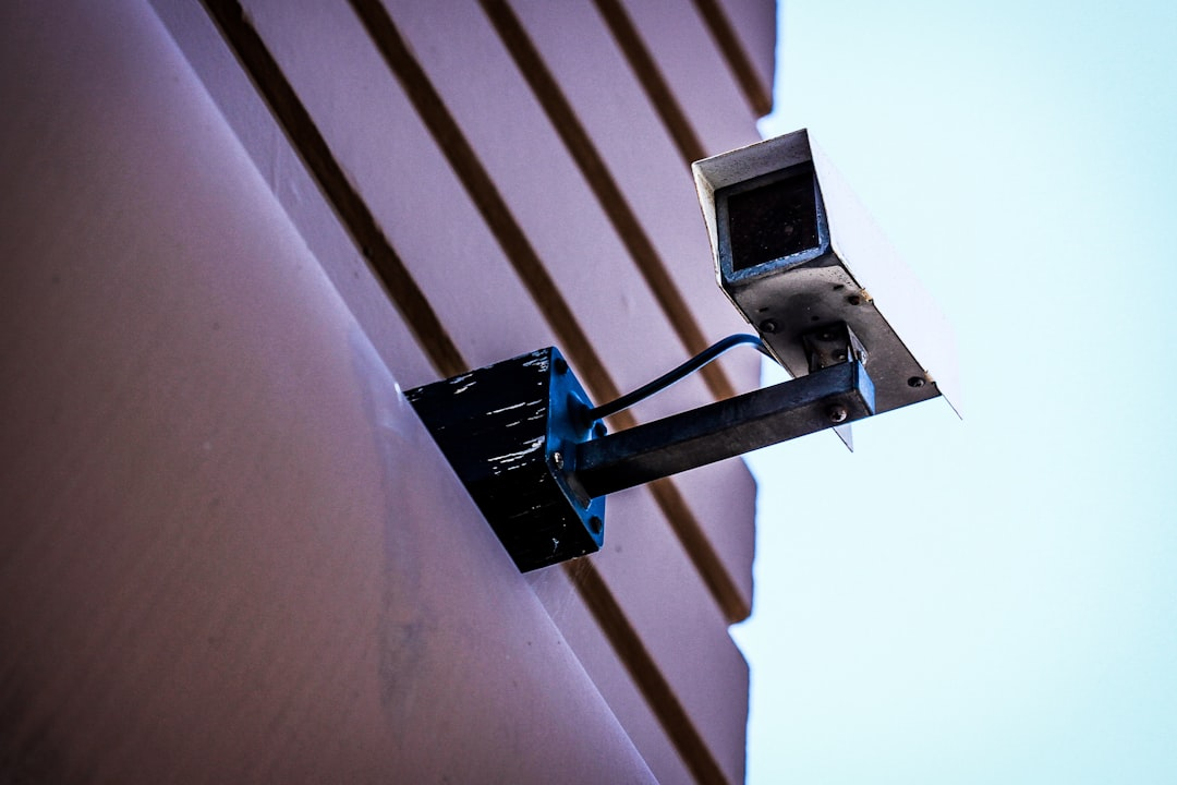 ALT= Security Companies Debt Collections + picture + camera on building + monitoring