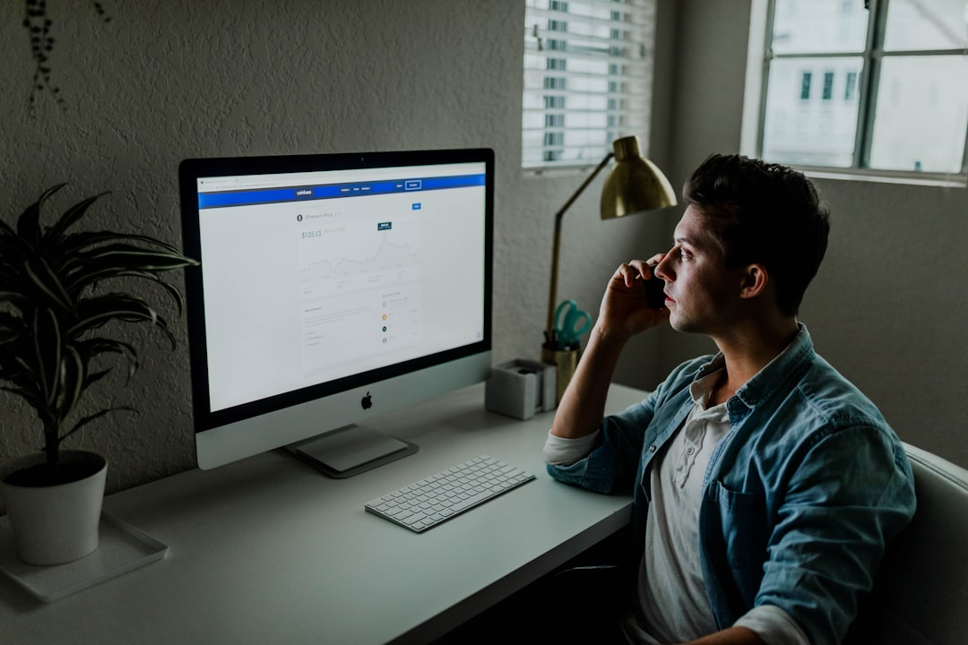 ALT= Debt Collection Agency for Small Business + picture + man at desk + working + computer