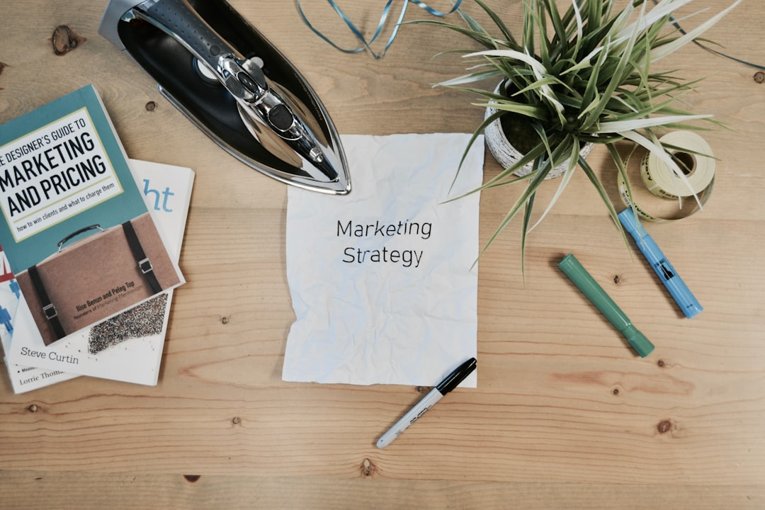 ALT= Debt Collections Marketing Companies + picture + desk with paper + pen + stapler + paper reads "marketing services"